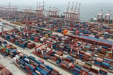 Shipping companies support a first-ever global fee on greenhouse gases, opposed by Trump officials