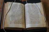 Researchers in Ireland uncover medieval book in Rome with oldest English poem | AP News