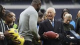 King Charles gets QB lesson at Tottenham Hotspur Stadium