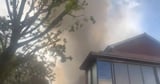 Huge fire at apartment block sparks 'stay indoors' warning for residents