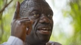 Wife of Ugandan opposition figure Besigye says he was kidnapped and is being held in a military jail