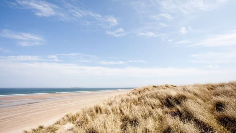 Bamburgh Crowned UK's Top Seaside Destination for Sixth Year, Celebrated for Tranquil Charm and Scenic Beauty