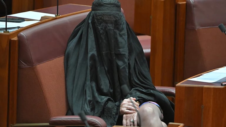 Pauline Hanson's Burqa Stunt Sparks Outrage, Senate Suspension Amid Racial Tensions