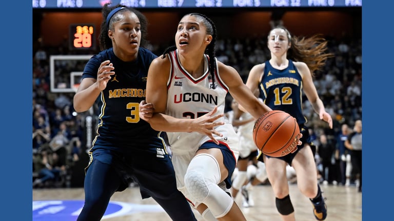UConn Triumphs Over Michigan in Intense Naismith Hall of Fame Showcase