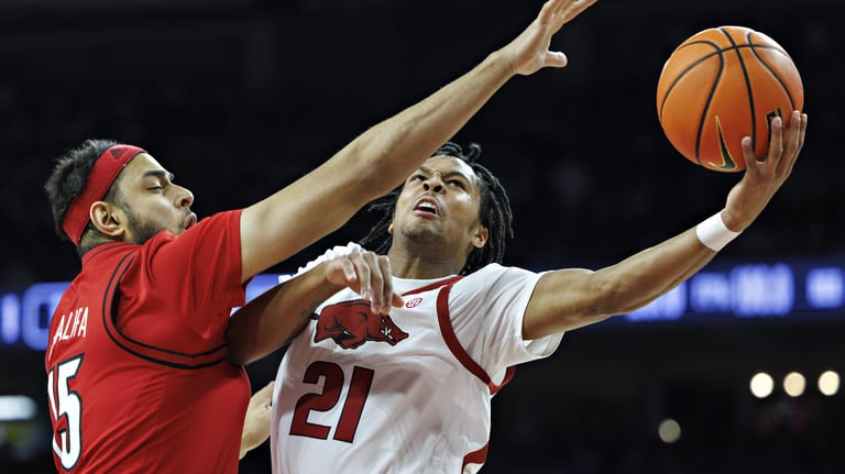 Arkansas Triumphs Over Louisville; SEC Narrows ACC Lead in 2025 Challenge