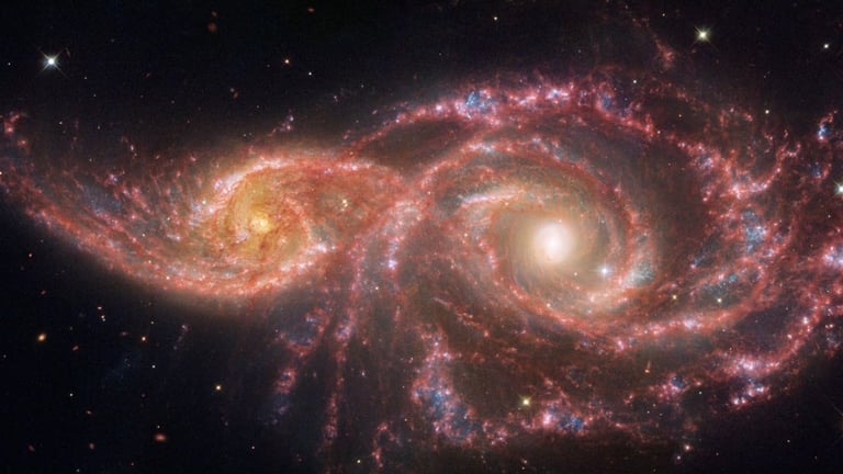 NASA's Webb and Hubble Capture Stunning Intertwined Spiral Galaxies in Cosmic Dance