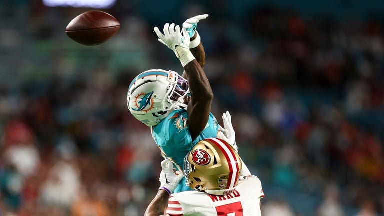 Tyreek Hill's Struggles: Drops, Injuries, and Practice Absences Impact Dolphins' Playoff Hopes