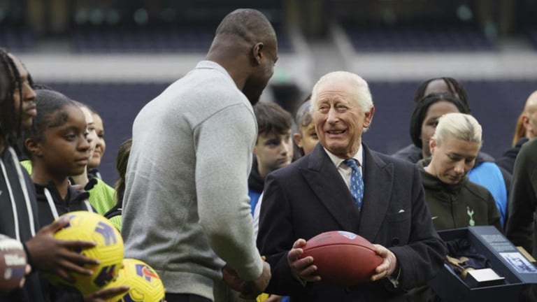 King Charles Visits Tottenham Stadium, Celebrates Community Impact and Throws American Football