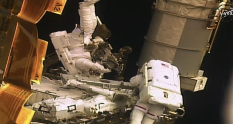 NASA Astronauts Conduct Spacewalk to Boost ISS Power with New Solar Arrays