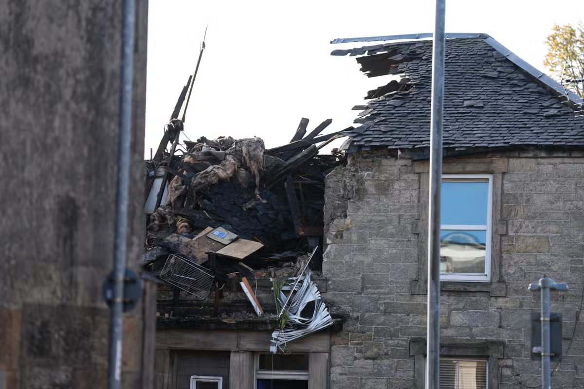 Police inquiries ongoing after man killed and three injured in flats blast