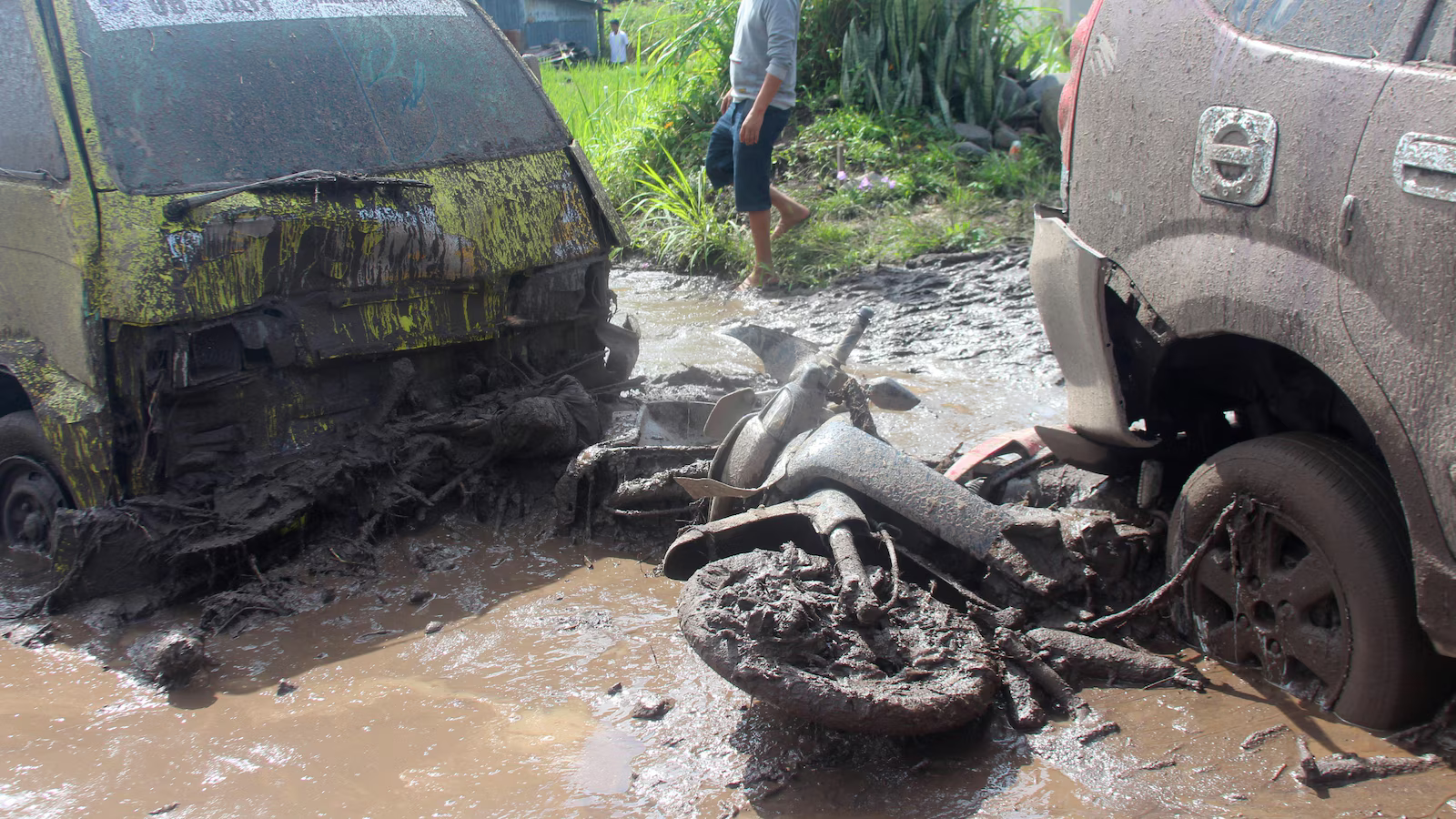 Flash floods and cold lava flow hit Indonesia’s Sumatra island, killing at least 15 people