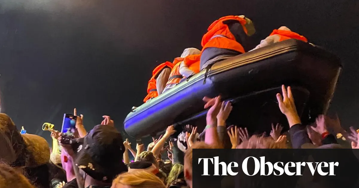 Banksy launches inflatable migrant boat artwork during Idles’ Glastonbury set