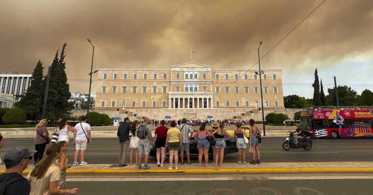 A wildfire near Greece's capital darkens Athens sky, moves fast - Los Angeles Times