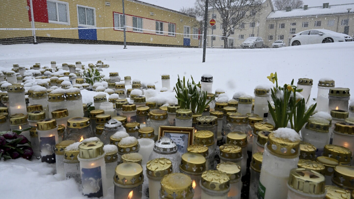 Mourners gather outside a Finnish school where a shooter killed a 12-year-old and wounded 2 others