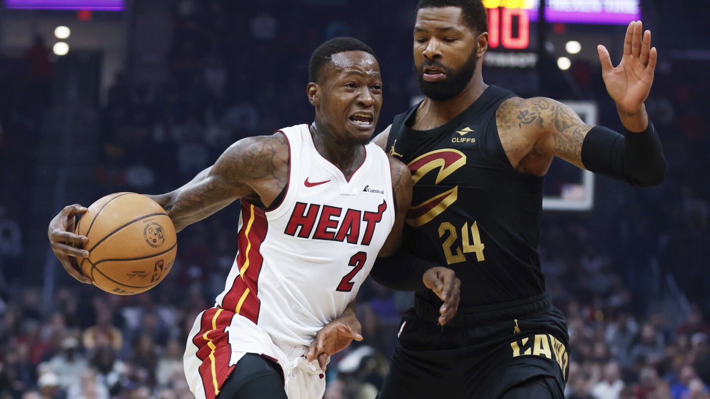 Terry Rozier's go-ahead 3-pointer with 14.5 seconds left helps the Heat beat the Cavaliers 107-104