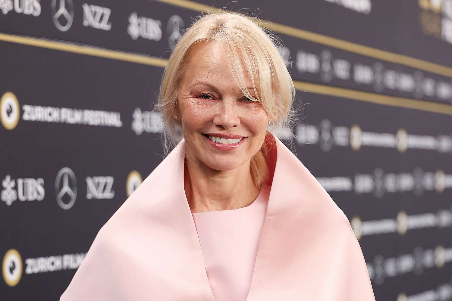 Pamela Anderson Is Pretty in Pink as She Shows Off Natural Look During Zurich Film Festival