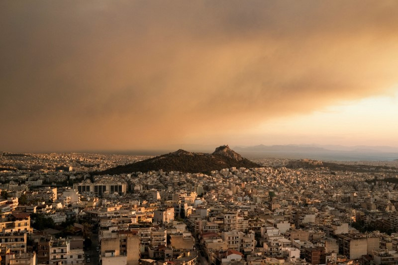 People flee wildfire near Athens as it spreads 'like lightning'